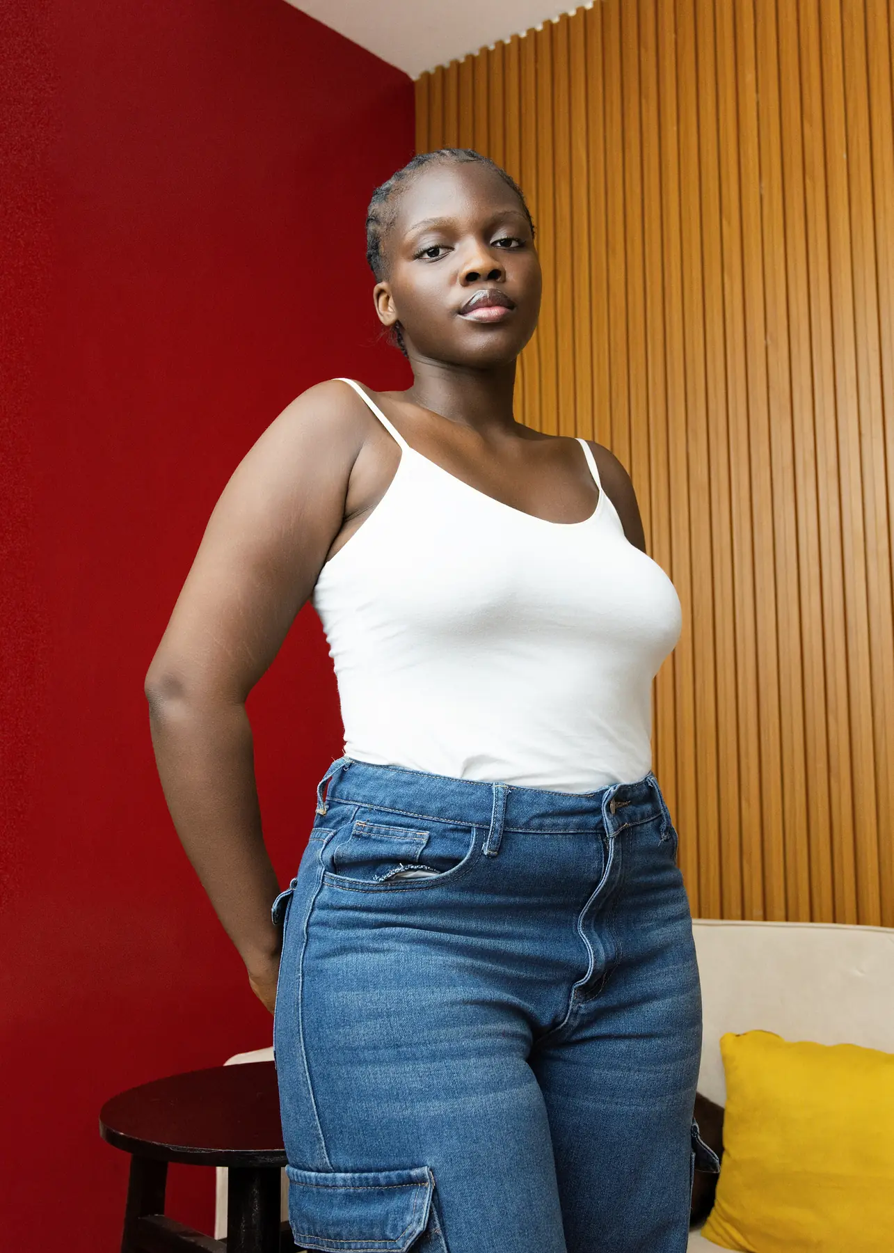 CURV model editorial image with red wall styling