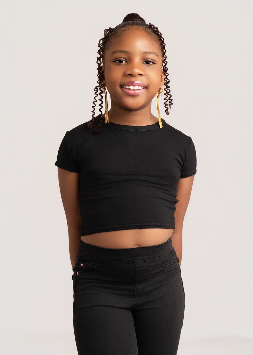 Young model practicing posing and presentation with DXC Kids Division